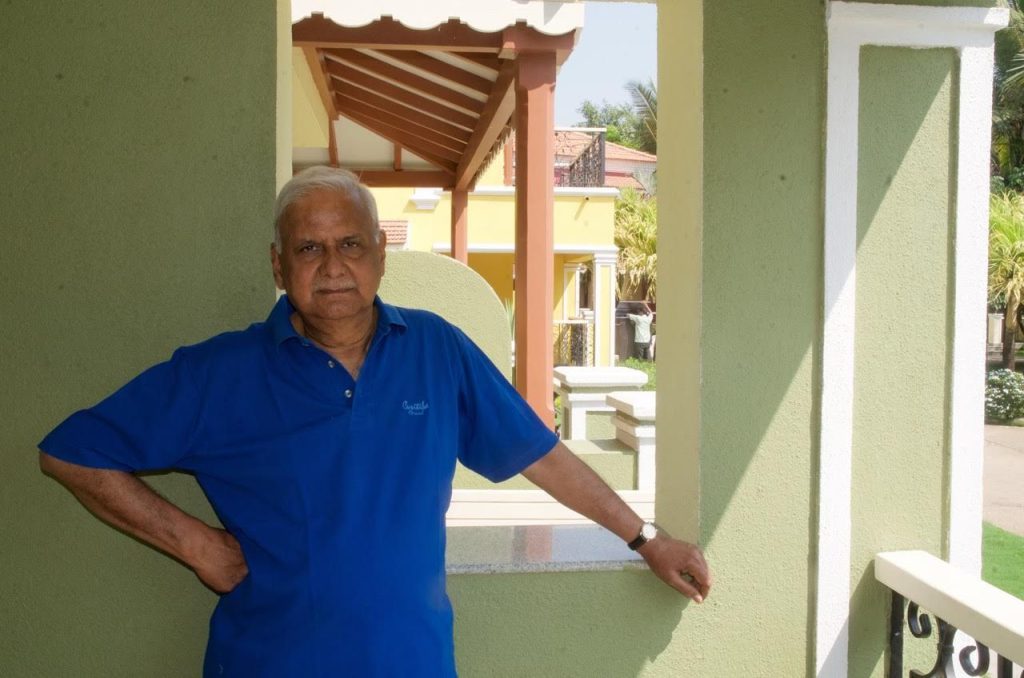 Professor Jagdeep Singh Chhokar standing on a shaded veranda